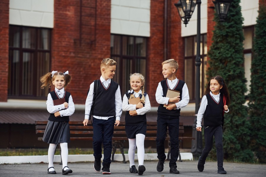 group-kids-school-uniform-that-is-outdoors-together-near-education-building.jpg