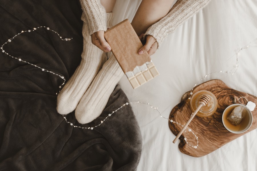 crop-woman-with-chocolate-near-honey-tea.jpg