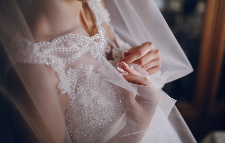 woman-touching-her-wedding-dress.jpg