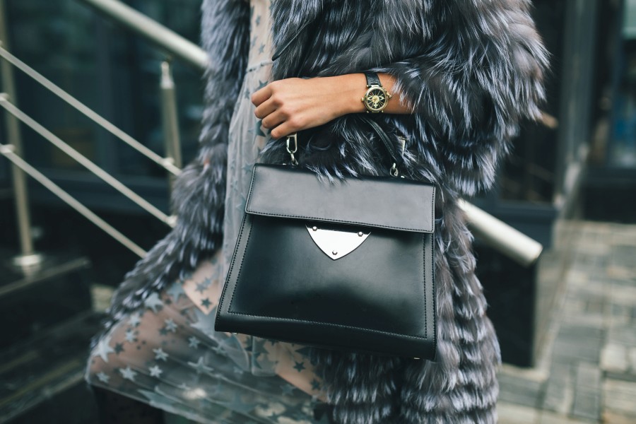 close-up-accessories-details-stylish-woman-walking-city-warm-fur-coat-holding-black-leather-bag-winter-season.jpg