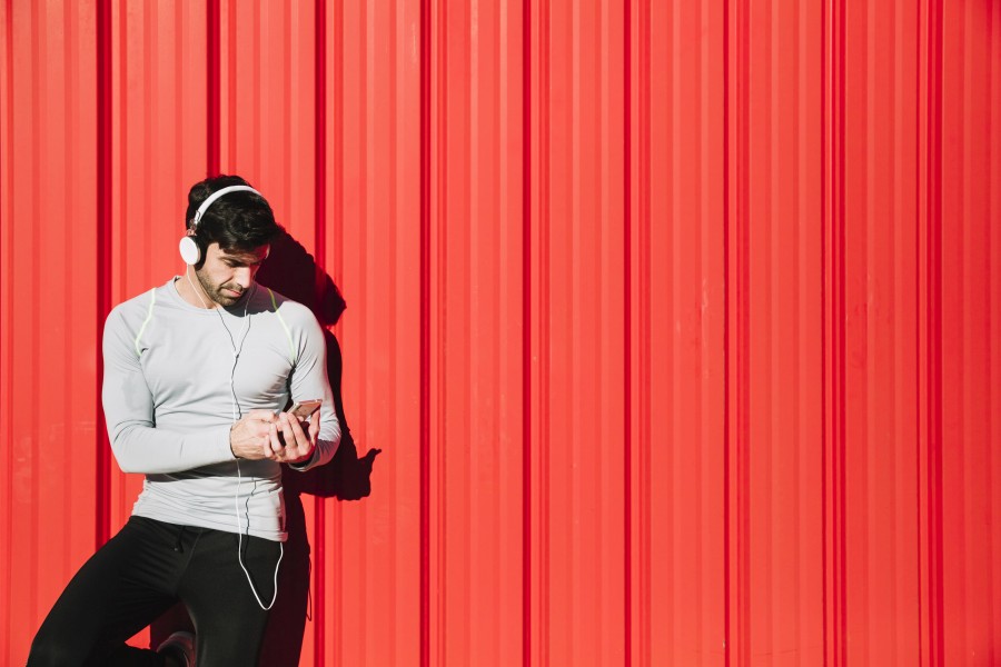 sporty-man-headphones-using-smartphone.jpg
