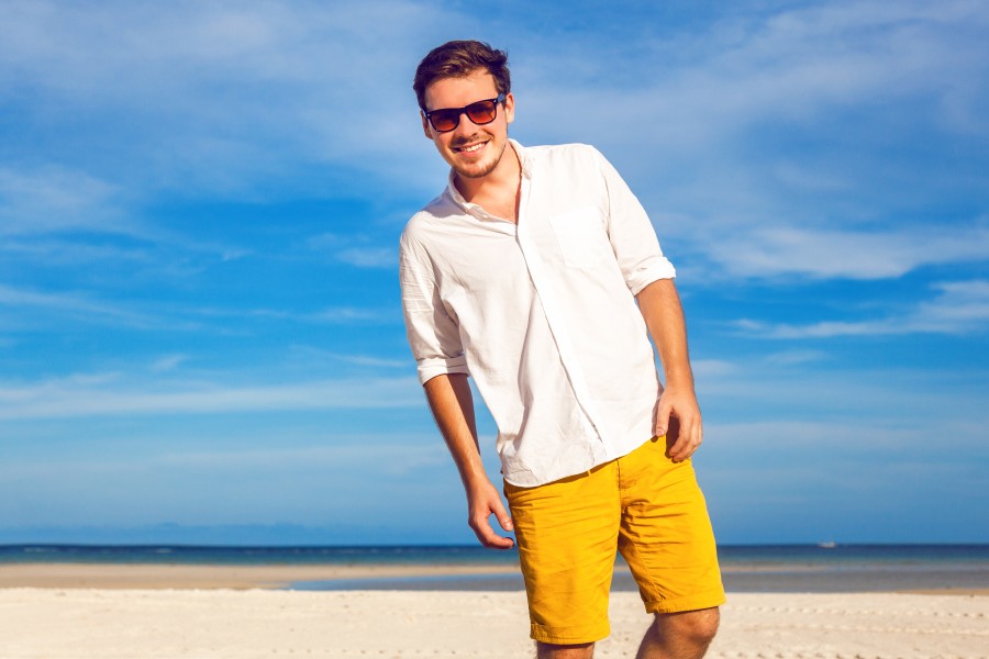 outdoor-fashion-portrait-handsome-man-posing-amazing-tropical-beach-nice-sunny-day-beautiful-view-blue-sky-ocean-wearing-casual-yellow-sorts-classic-white-shi.jpg