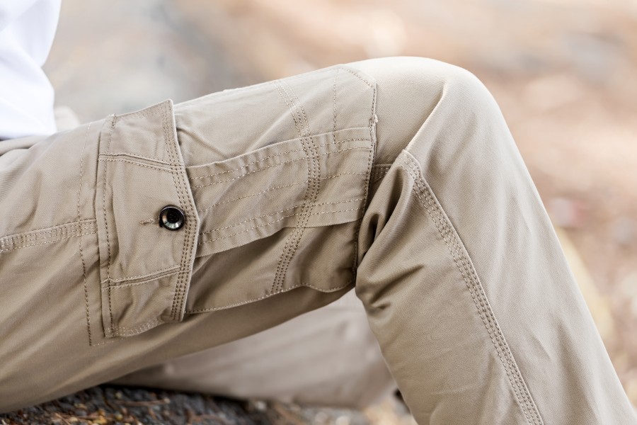 man-wearing-brown-cargo-pants-sitting-nature-park.jpg