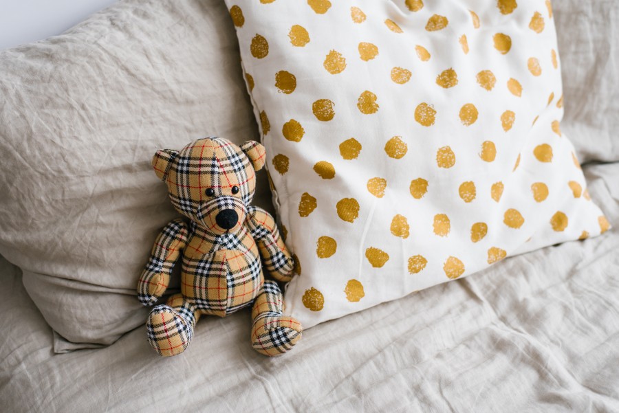 soft-plaid-toy-bear-pillows-bed.jpg