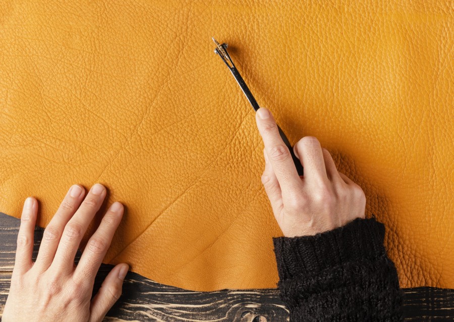 close-up-hand-cutting-leather.jpg