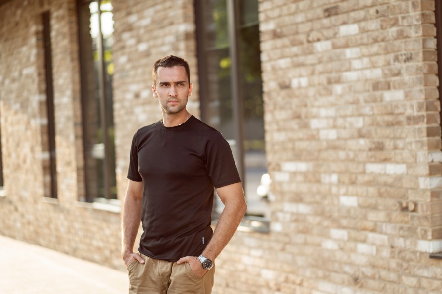handsome-man-with-short-bristles-black-tshirt-background-brick-wall.jpg