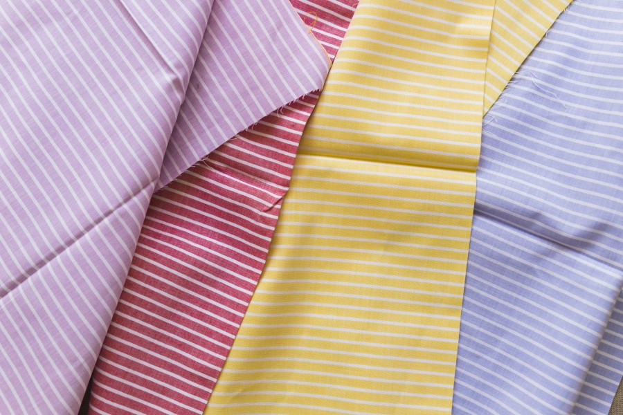 high-angle-view-various-multi-colored-stripes-pattern-textiles.jpg