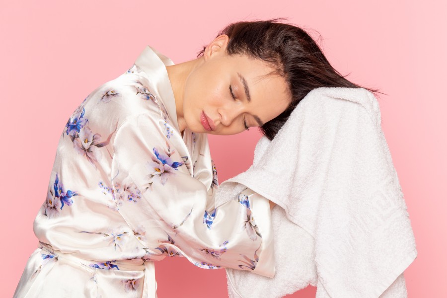 front-view-young-beautiful-lady-bathrobe-drying-her-hair.jpg