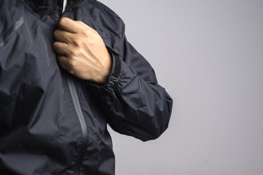 man-wearing-black-anti-static-wet-weather-jacket-rain-coat.jpg