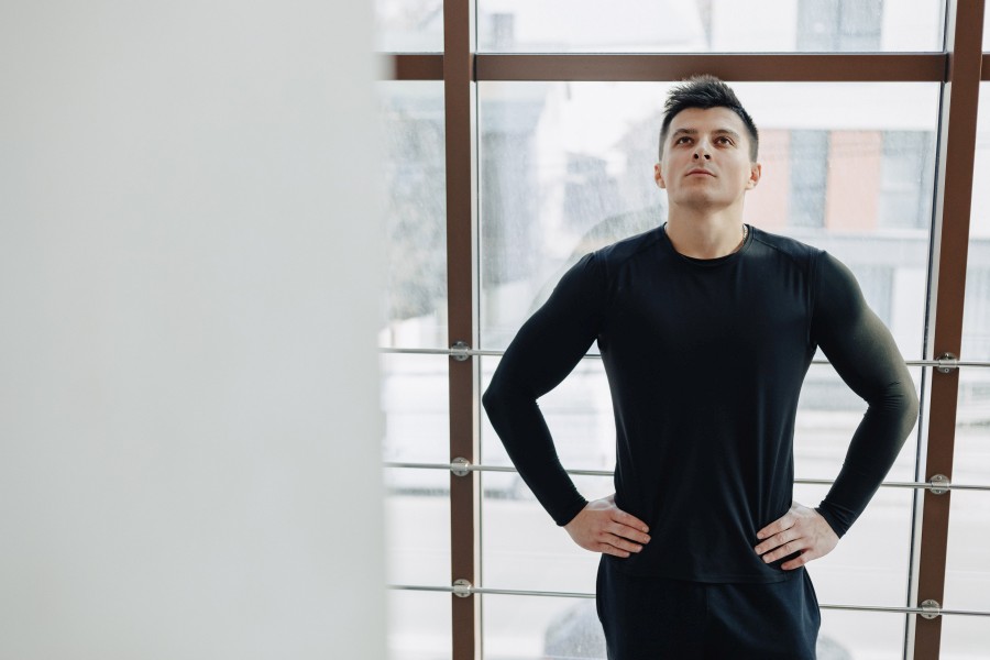 attractive-sporty-guy-by-window-athlete-posing-near-spacious-windows-gym-sports.jpg