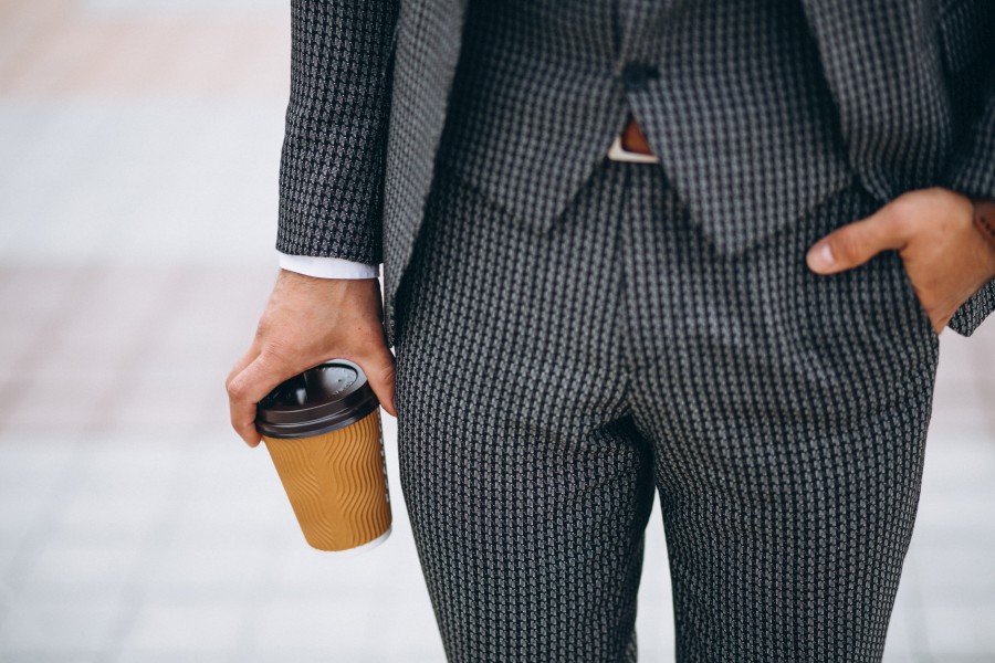 male-suit-close-up-holding-coffee-hand.jpg